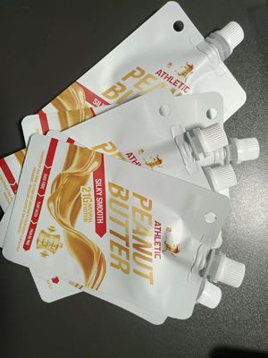保証された安全性 トップジュースの保管用のカスタムPET/VMPET/PE透明なノズルバッグ